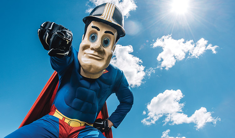 Purdue Pete in a superman costume