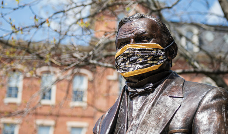 john purdue statue wearing a protective face mask