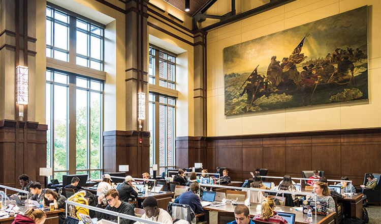 A large painting of Washington Crossing the Delaware hangs on the wall overlooking dozens of students studying